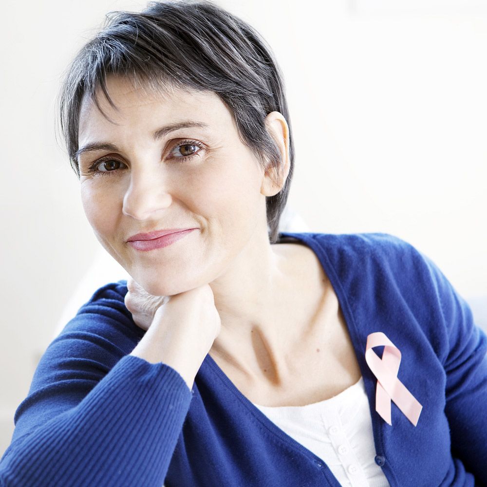 Woman resting chin on hand