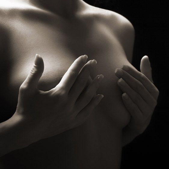 woman covering breasts